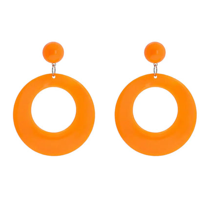 Ett par örhängen i retrostil, neonorange