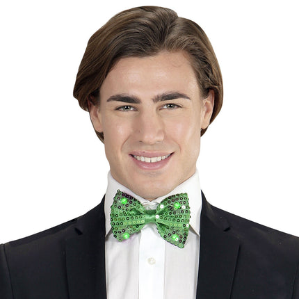 Grön rosett paljetter med ljus