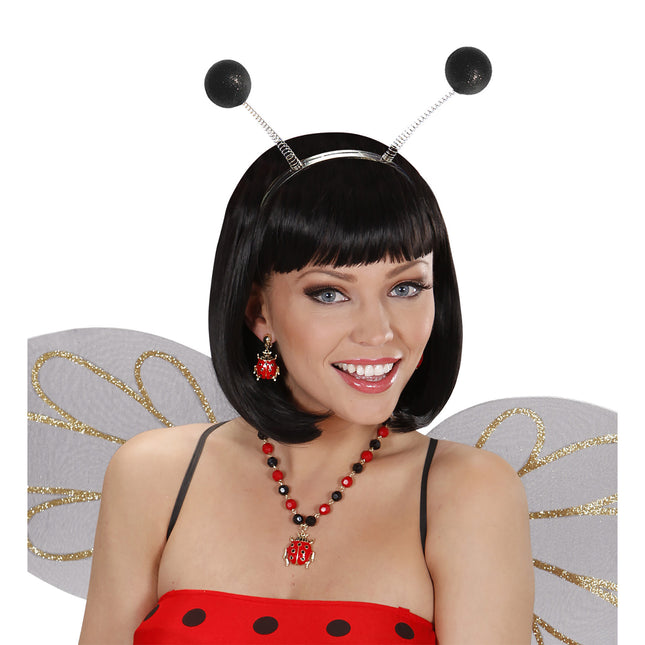 Svart hårbandsantenn med glitter