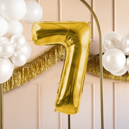 7 års figurballong guld tom 72 cm